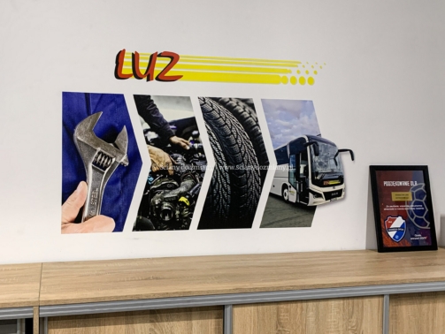 Identyfikacja wizualna firmy LUZ Opole – branding ścienny z logo oraz grafikami przedstawiającymi narzędzia, serwis mechaniczny, opony i autobus.